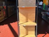 a display case with shelves in the middle of a store