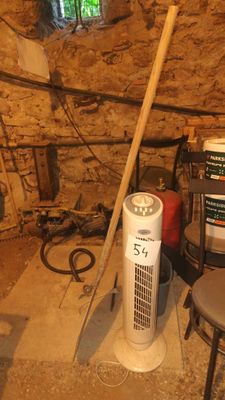 an image of a room that has a fan in it