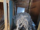 a pile of wires in the corner of a room