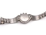 a close up of a watch on a white surface with a white background