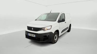 a white van is parked in a white room