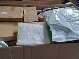 a cardboard box full of boxes and other items in it