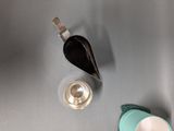 two cups and a spoon sitting on a table