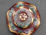 a picture of a red and green flower broochee