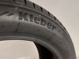 a close up of a tire on a white surface