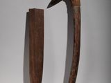 two pieces of wood are sitting next to each other on a white surface