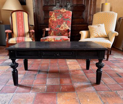 two chairs and a table in a living room