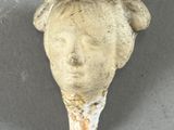 a small animal head on the floor of a room