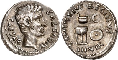 a silver coin with an image of a man holding a wine glass