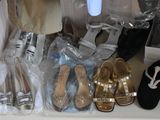 many pairs of shoes that are sitting on a shelf