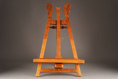 an old wooden easer with two legs on a gray background