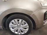 a car that has been dented and is parked in a garage