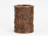 an antique wooden brush holder with carvings on it on a white background