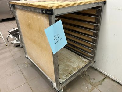 a wooden counter with a sign on it in a kitchen