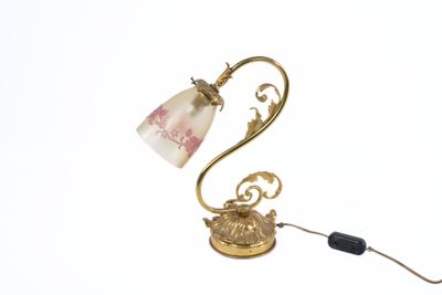 a lamp that is sitting on a table next to a cord