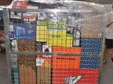 a metal cart with many boxes on it in a warehouse