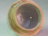 a vase that has a hole in the middle of it