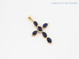 an image of a cross pendant with blue stones on a white background