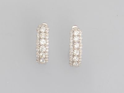 a pair of diamond hoop earrings