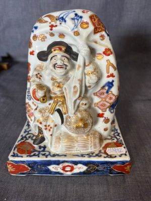 an image of a figurine of a woman holding a basket