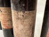several bottles of wine are lined up on a table