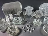 several pieces of glass are arranged on a table