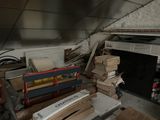 a pile of boxes and boxes on the floor of a room