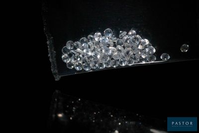 a bag full of clear crystals sitting on a table