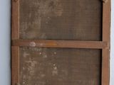 a picture of an old wooden frame hanging on the wall