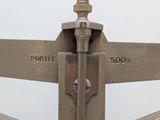 a close up of a metal pole with a sign pointing in opposite directions
