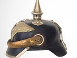 a black helmet with a gold decoration on it