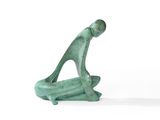 sculpture of a man sitting on a surfboard on a white surface