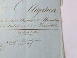 an old document with writing on it sitting on a table