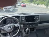 a view of the inside of a car from the driver ' s seat
