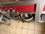 pots and pans that are sitting on the floor