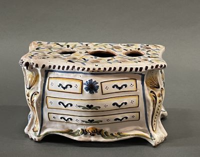 a white and black box with a design on it