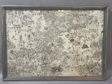 an image of a picture of a dirty wall with a silver frame