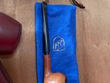 a pair of shoes and a pipe sitting on a table