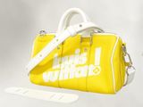a yellow handbag with a white handle and a white strap