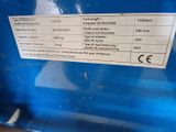 a label on the side of a blue container