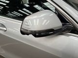 a reflection of a helmet on the side mirror of a car
