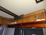 a picture of a kitchen with wood cabinets and a ceiling fan