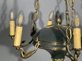 a chandelier with five lights hanging from the ceiling