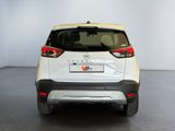 a white car that is parked in a room