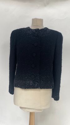 an image of a black jacket on a mannequin