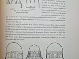 an open book with a drawing of a building and a drawing of a dome