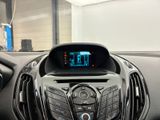 a car dashboard with a digital display in the center
