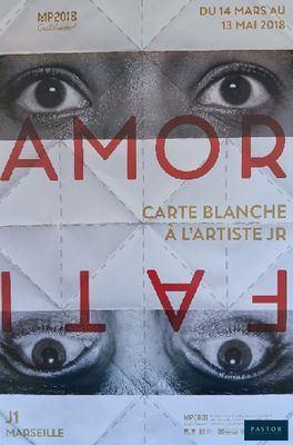 a poster with a picture of a woman ' s eyes on it