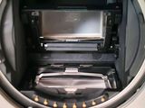 a close up view of a washing machine with the door open