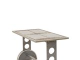 a close up of a table with a metal base and a tile top